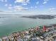 Aerial view of a house by the water with a bridge in the background at 2740 E Vina Del Mar Blvd, St Pete Beach, FL 33706