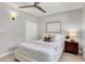 Bedroom with queen bed and wooden nightstand at 2740 E Vina Del Mar Blvd, St Pete Beach, FL 33706