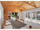 Spacious dining area with wood ceiling and pool view at 2740 E Vina Del Mar Blvd, St Pete Beach, FL 33706