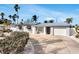 Newly renovated Florida home with metal roof and tropical landscaping at 2740 E Vina Del Mar Blvd, St Pete Beach, FL 33706