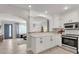 Modern kitchen with white cabinets, granite countertops and breakfast bar at 2740 E Vina Del Mar Blvd, St Pete Beach, FL 33706