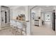 Modern kitchen with breakfast bar, white cabinets and stainless steel appliances at 2740 E Vina Del Mar Blvd, St Pete Beach, FL 33706