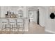 Modern kitchen with breakfast bar and stainless steel appliances at 2740 E Vina Del Mar Blvd, St Pete Beach, FL 33706