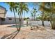 Inviting pool area with patio furniture and lush landscaping at 2740 E Vina Del Mar Blvd, St Pete Beach, FL 33706