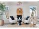 Bright sunroom features stylish seating and large windows at 2740 E Vina Del Mar Blvd, St Pete Beach, FL 33706