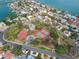 Aerial view of tennis courts and pickleball courts in a neighborhood at 2740 E Vina Del Mar Blvd, St Pete Beach, FL 33706