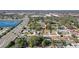 Wide aerial view of neighborhood near a lake and main road at 306 Scott Ct, Palm Harbor, FL 34684