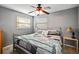 Bright bedroom with a double bed and ceiling fan at 306 Scott Ct, Palm Harbor, FL 34684