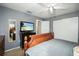 Bright bedroom with a large bed and access to another room at 306 Scott Ct, Palm Harbor, FL 34684