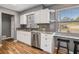 Bright kitchen with granite countertops and stainless steel appliances at 306 Scott Ct, Palm Harbor, FL 34684