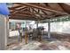 Covered patio with dining area and grill at 306 Scott Ct, Palm Harbor, FL 34684