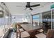 Screened patio with hot tub, dining table, and view of the refreshing pool at 306 Scott Ct, Palm Harbor, FL 34684