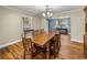 Formal dining room with wood table and chairs, hardwood floors and natural light at 35351 Nina Sue Ln, Dade City, FL 33523