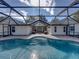 View of the house from the pool area, showcasing the patio and screened enclosure at 35351 Nina Sue Ln, Dade City, FL 33523