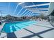 Inviting community swimming pool with a screened enclosure at 37443 Blueberry Ct, Zephyrhills, FL 33542