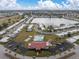 Aerial view of community, showcasing clubhouse, pool, and lake at 4526 101St N Ave, Pinellas Park, FL 33782