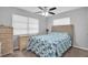 Bedroom with wicker dresser and ceiling fan at 4526 101St N Ave, Pinellas Park, FL 33782