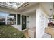 Inviting front entrance with green door and a decorative block wall at 4526 101St N Ave, Pinellas Park, FL 33782