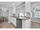 Modern kitchen with white cabinets, granite countertops and stainless steel appliances at 4526 101St N Ave, Pinellas Park, FL 33782