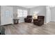 Bright living room with two brown recliner chairs and hardwood floors at 4526 101St N Ave, Pinellas Park, FL 33782