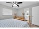 Main bedroom with dresser and ensuite bathroom at 4526 101St N Ave, Pinellas Park, FL 33782