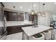 Modern kitchen featuring dark cabinetry, white quartz countertops, and a large island at 4559 Ballantrae Blvd, Land O Lakes, FL 34638