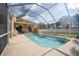 Refreshing screened pool with backyard access and patio at 4709 Red Warbler Ln, Valrico, FL 33596