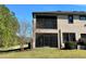 Backyard view of home with screened patio at 4899 Isola Ct, Wesley Chapel, FL 33543