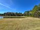 Pond and preserve landscape with walking path at 4899 Isola Ct, Wesley Chapel, FL 33543
