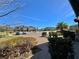 Community view with homes and a central courtyard at 4899 Isola Ct, Wesley Chapel, FL 33543