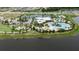 Community overview featuring pools, tennis courts, playground, and parking at 5612 Limelight Dr, Apollo Beach, FL 33572