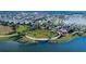 Aerial view of a community with a lake, park, and many houses at 5612 Limelight Dr, Apollo Beach, FL 33572