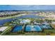 Aerial view of tennis and basketball courts, and clubhouse at 5612 Limelight Dr, Apollo Beach, FL 33572