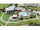 Community pool and clubhouse with surrounding landscape at 5612 Limelight Dr, Apollo Beach, FL 33572