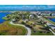 Aerial view showing community features including a park, lake, and residential homes at 5612 Limelight Dr, Apollo Beach, FL 33572