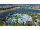 Aerial view of community pool, clubhouse, and surrounding landscape at 5612 Limelight Dr, Apollo Beach, FL 33572