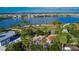 Aerial view of a community with a lake, park, playground, and palm trees at 5612 Limelight Dr, Apollo Beach, FL 33572
