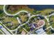 Aerial view of a community park with winding paths, playground, and dog park at 5612 Limelight Dr, Apollo Beach, FL 33572