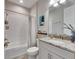 Clean bathroom with tub, shower, and granite vanity at 5612 Limelight Dr, Apollo Beach, FL 33572