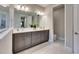 Bathroom boasts double sinks, ample counter space, and modern cabinets at 5612 Limelight Dr, Apollo Beach, FL 33572