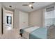 Cozy bedroom with double bed, ceiling fan, and window coverings at 5612 Limelight Dr, Apollo Beach, FL 33572