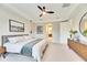 Spacious bedroom with large bed, dresser, and ceiling fan at 5612 Limelight Dr, Apollo Beach, FL 33572