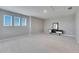 Spacious bonus room featuring three windows and plush carpeting at 5612 Limelight Dr, Apollo Beach, FL 33572
