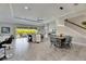 Open concept living and dining area with tile floors at 5612 Limelight Dr, Apollo Beach, FL 33572