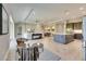 Open living space with modern furniture,tile floors, and access to kitchen and backyard at 5612 Limelight Dr, Apollo Beach, FL 33572