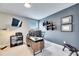 Home office with large desk and wall-mounted TV at 5612 Limelight Dr, Apollo Beach, FL 33572