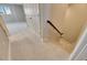 Carpeted staircase with wooden handrail at 5612 Limelight Dr, Apollo Beach, FL 33572
