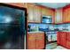 Kitchen offers stainless steel appliances and wood cabinetry at 6317 20Th S Ave, Tampa, FL 33619