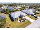 Aerial view of single-Gathering home with pool and landscaped yard at 72 Norman St, Port Charlotte, FL 33954