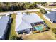 Aerial view of single-Gathering home with pool and fenced backyard at 72 Norman St, Port Charlotte, FL 33954